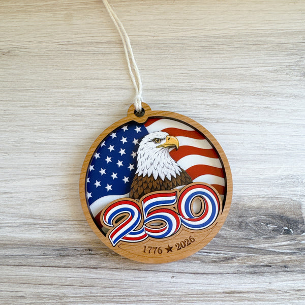 Wooden ornament with American flag and eagle design on a wooden surface